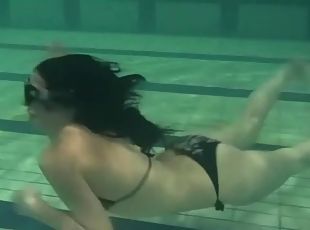 She strips from bikini as she goes swimming